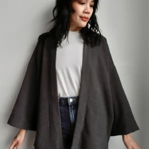 Model wearing a grey kimono, made from sustainable deadstock modal fabric.