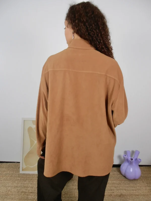 Back view of a vintage camel microsuede blouse.