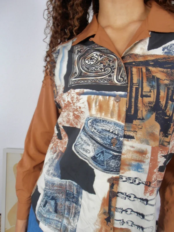 Close-up of vintage tan and multicolour print blouse.