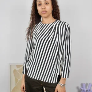 Front view of a vintage black and white striped blouse with side slit detail.