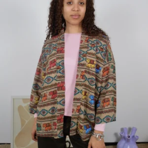 Front view of a beige kimono with multicolor elephant print on sustainable cotton-linen deadstock fabric.