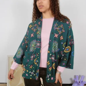 Front view of a sustainably made green kimono with multicolor pattern on cotton-linen deadstock fabric.