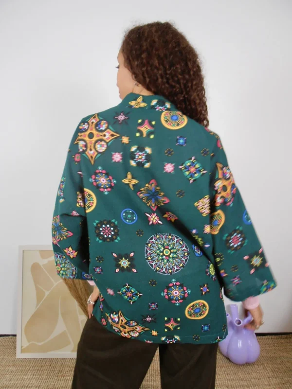 Back view of a green kimono with multicolor pattern on ethically sourced cotton-linen fabric.